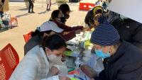 Community Outreach sign up at a table